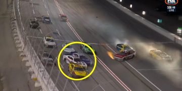 Shane van Gisbergen (circled) spins after being hit by Tyler Reddick.